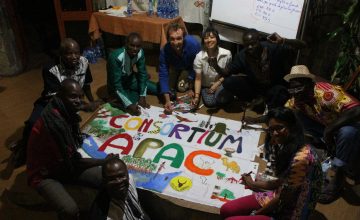 The french speaking team working on its banner